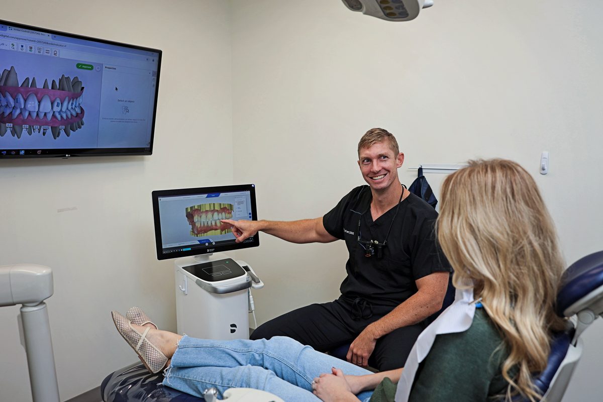 Dentist showing a patient a digital scan of her teeth